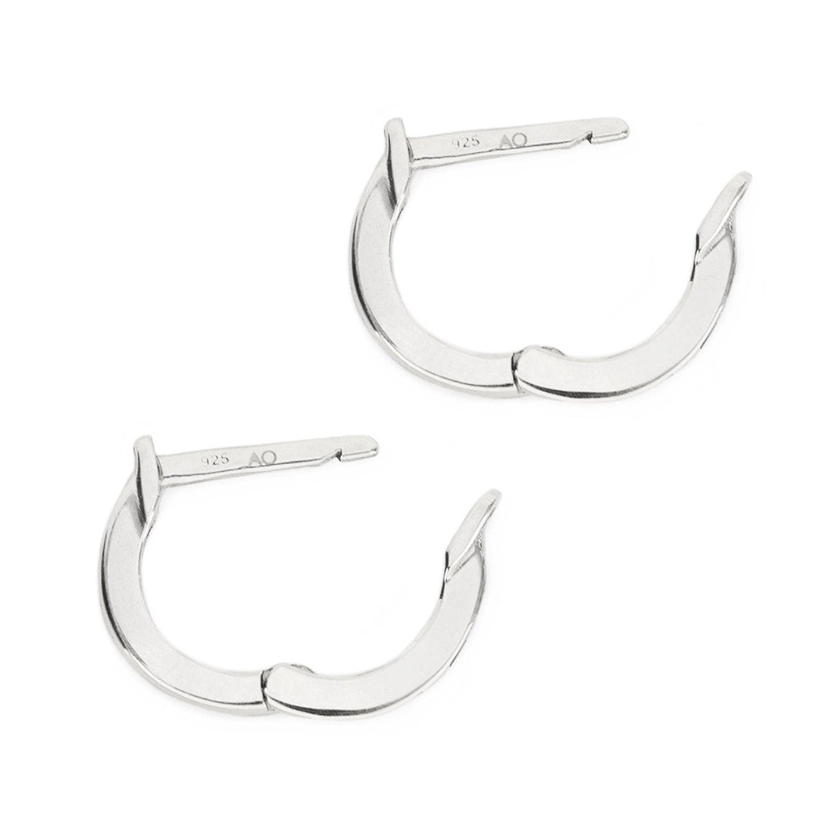 Pair of sterling silver plain huggie earrings, open hinged closures, close-up detail on a white background