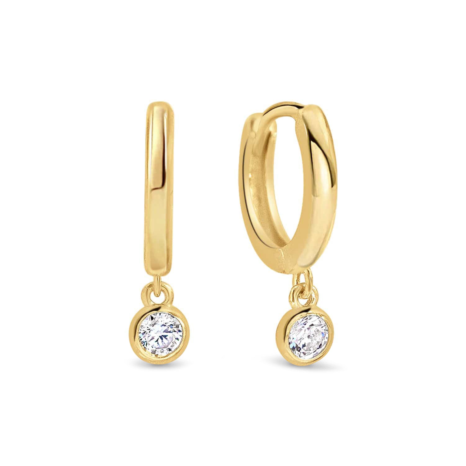 Pair of gold vermeil huggie hoops with dangling white zirconia drops, on a white background