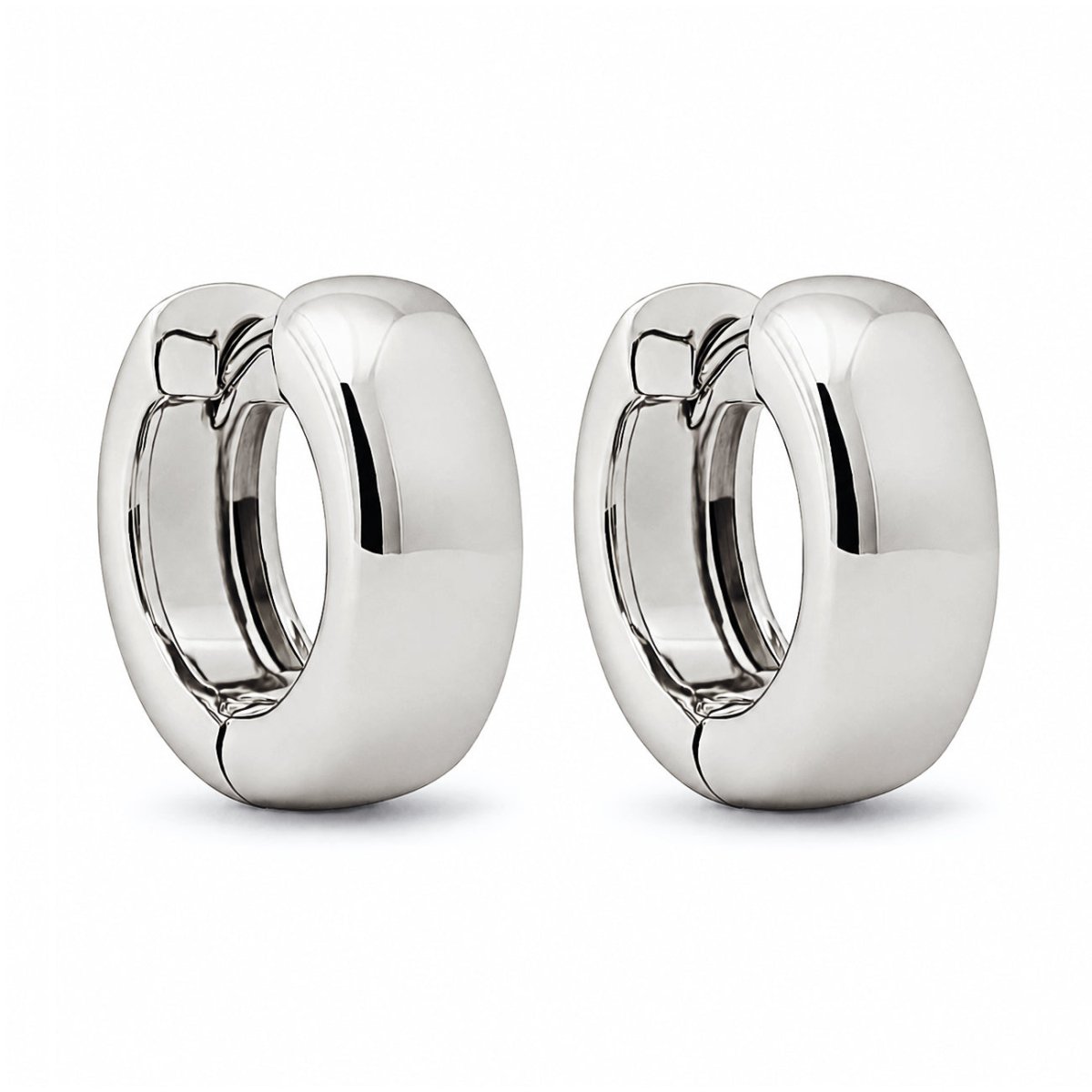 Sterling silver chunky boyfriend mini hoop earrings, on a white background