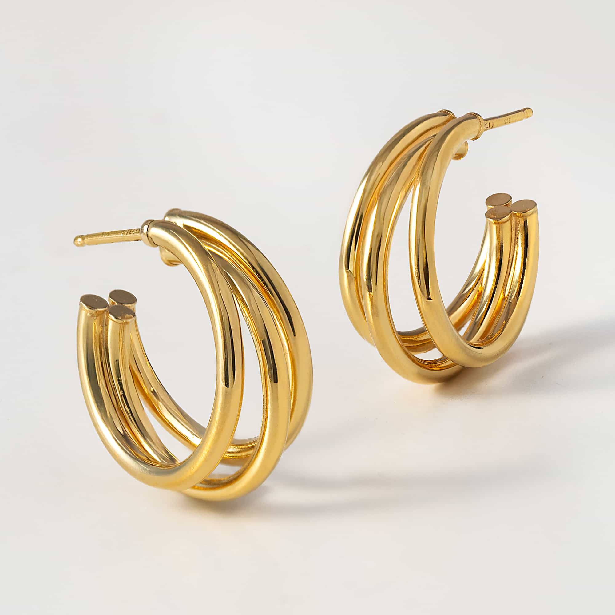 Gold vermeil triple-row open hoop earrings shown at an angle on a white background