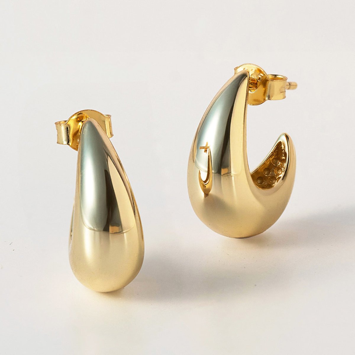 Gold vermeil chunky tapered teardrop dome hoop earrings with post backs, close-up detail