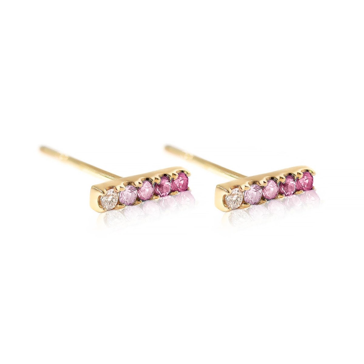 Pair of 14K gold bar studs with ombre clear and pink sapphire stones, on a white background
