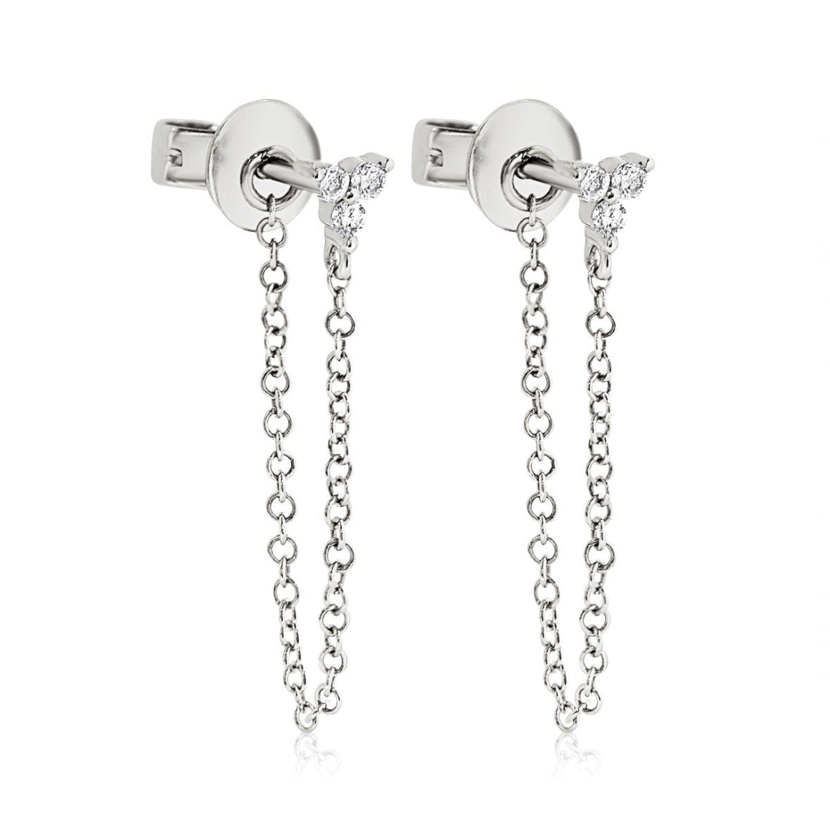 Pair of 14K white gold three-stone diamond chain stud earrings with draped chains, on a white background