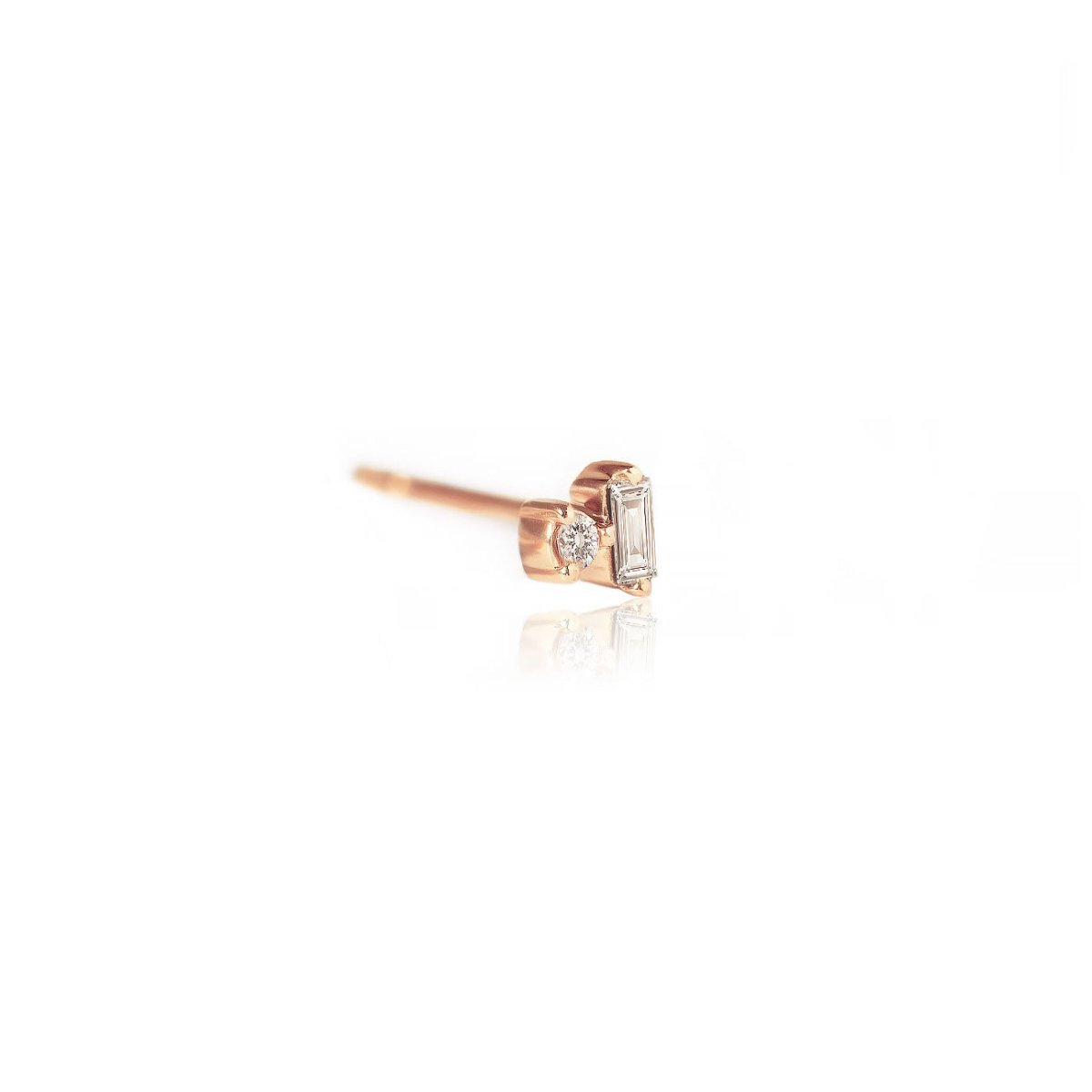 14K rose gold stud with a baguette and round diamond, side view on a white background