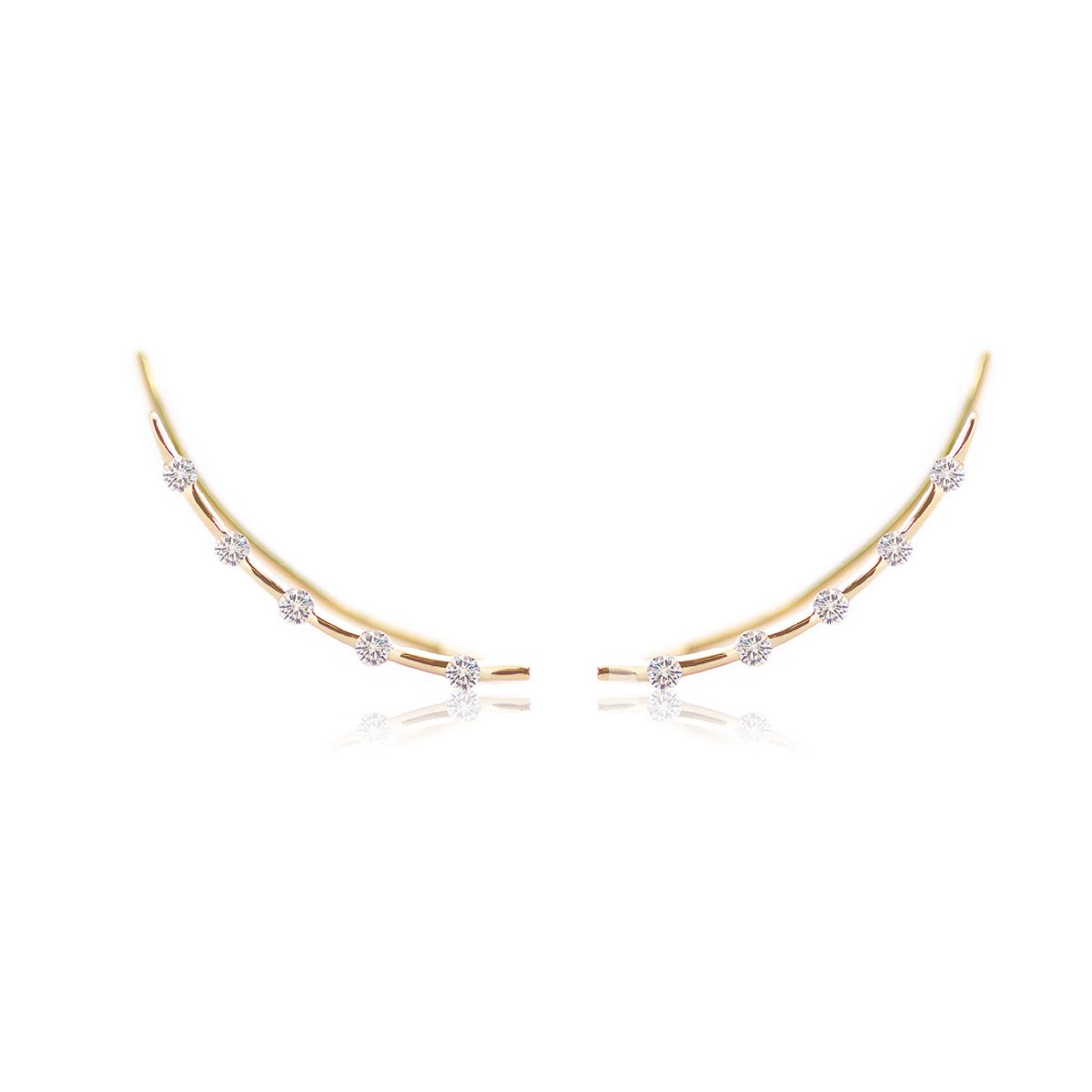 14K gold curved climber earrings set with a row of small round clear stones, on a white background