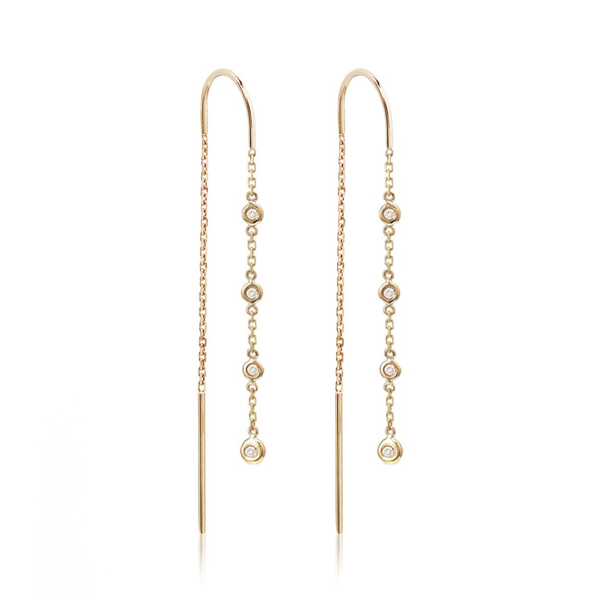 Pair of 14K gold diamond drop threader earrings with bezel-set clear stones, on a white background
