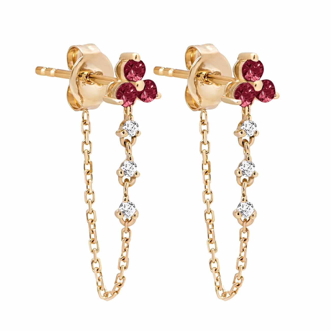 Pair of 14K gold chain earrings with a three-stone ruby cluster and dangling clear stones, on a white background