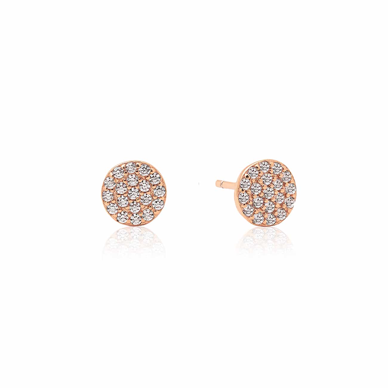 Pair of 14K rose gold pavé disc studs with round clear stones, on a white background