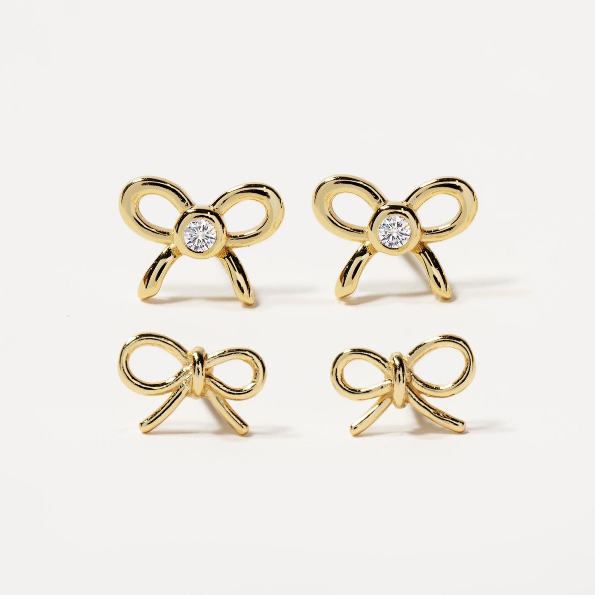 Close up of earring featuring Gold Vermeil Bow Studs