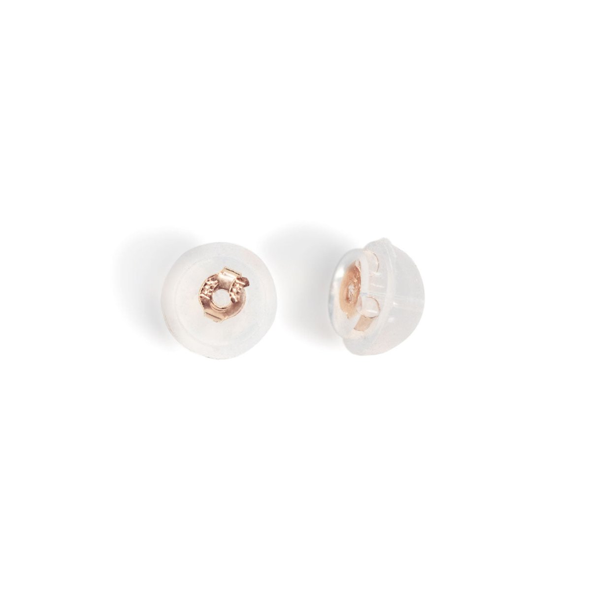 14K rose gold push-back earring backs with clear silicone discs, close-up on a white background
