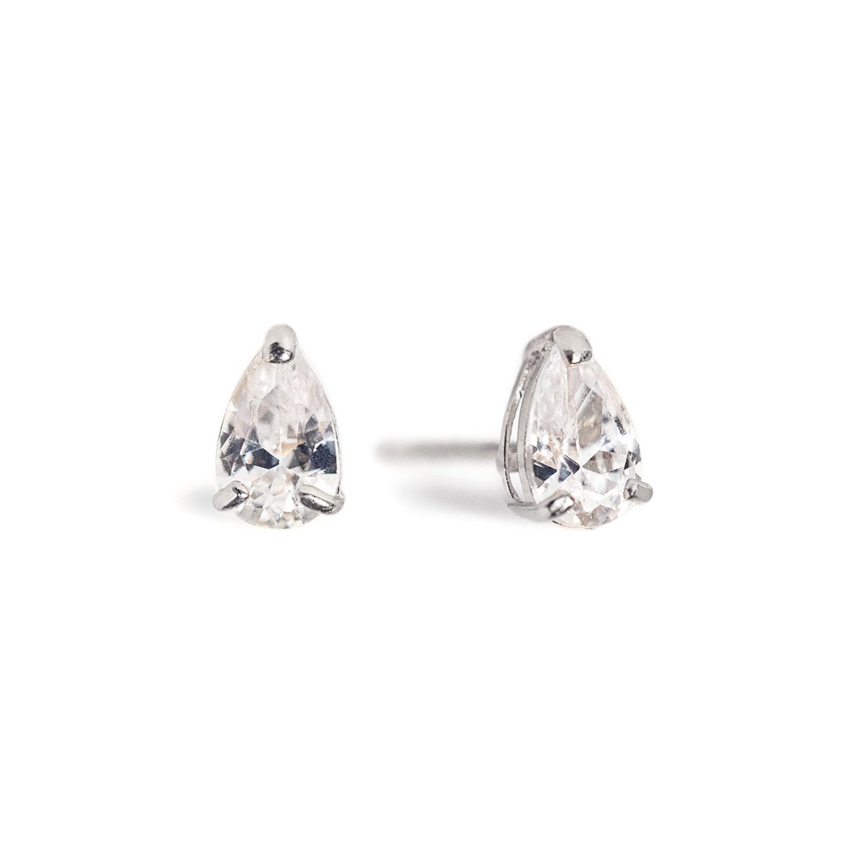 Pair of 14K white gold pear-shaped stud earrings with clear prong-set stones, on a white background