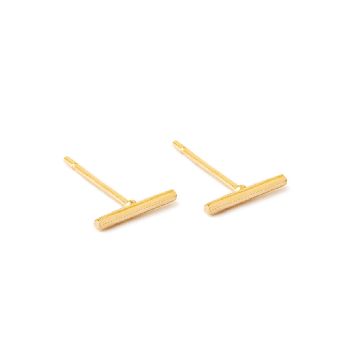 Pair of 14K gold thin bar stud earrings with post backs, on a white background