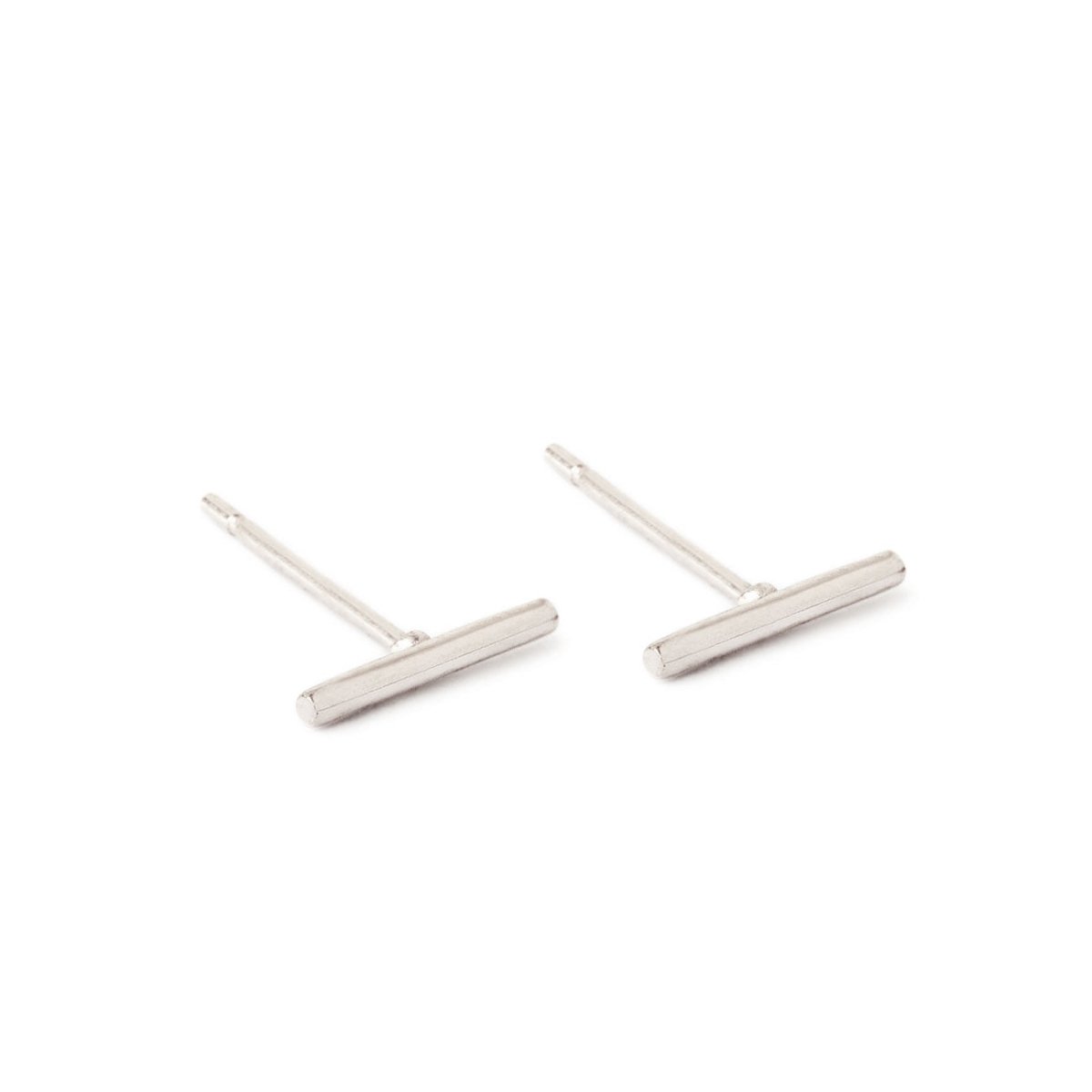 Pair of 14K white gold thin bar stud earrings with post backs, on a white background