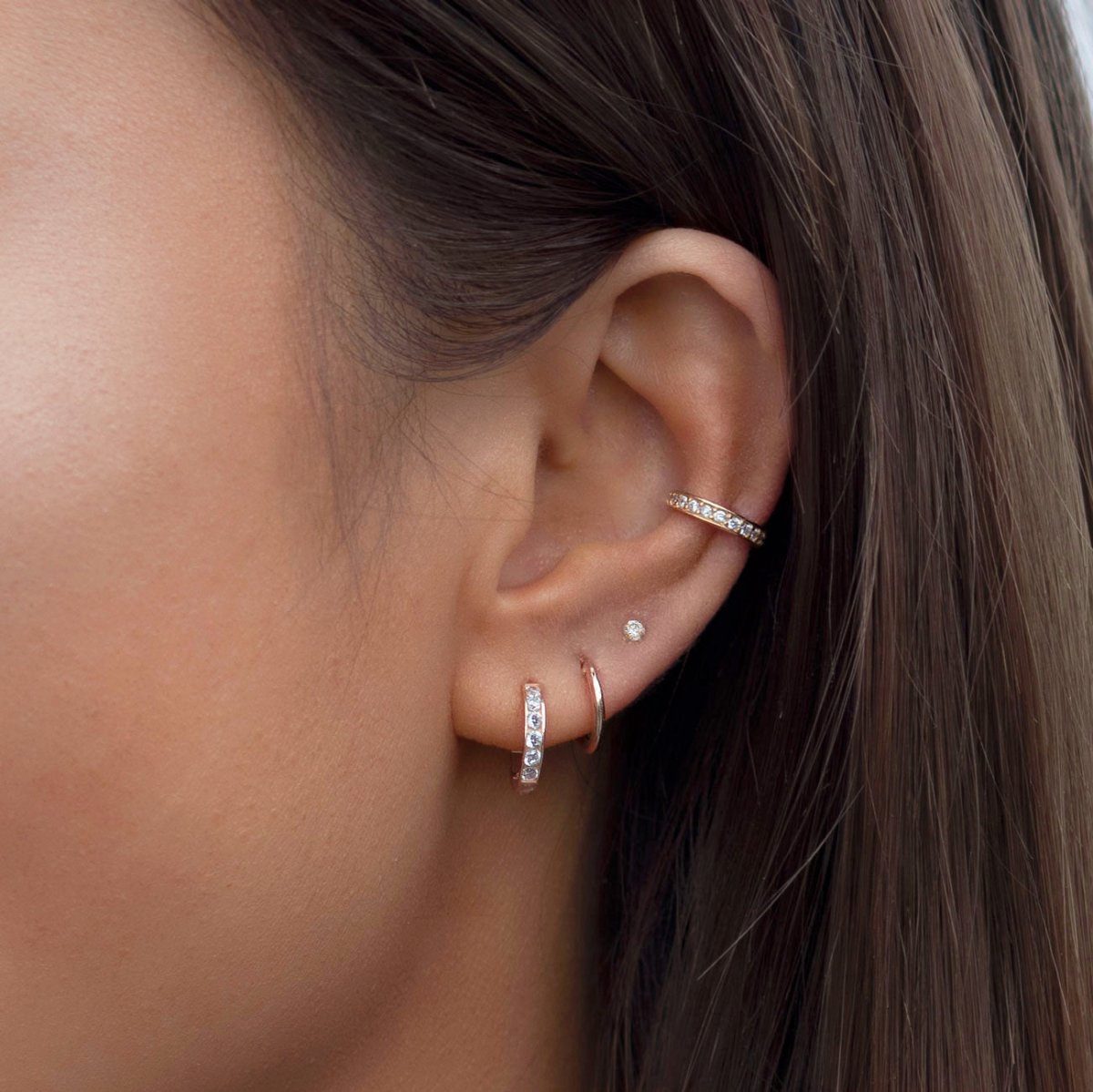 Rose gold vermeil pavé ear cuff with white zirconia, shown on a model's ear