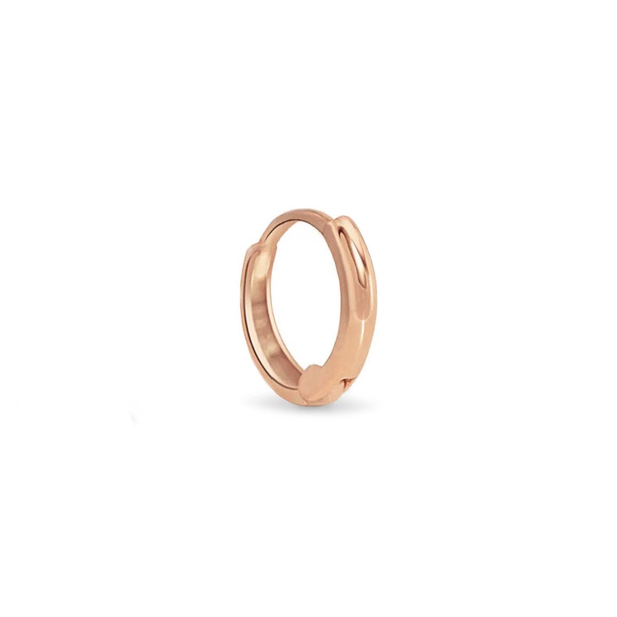 14K rose gold thin mini huggie hoop with a hinged closure, on a white background