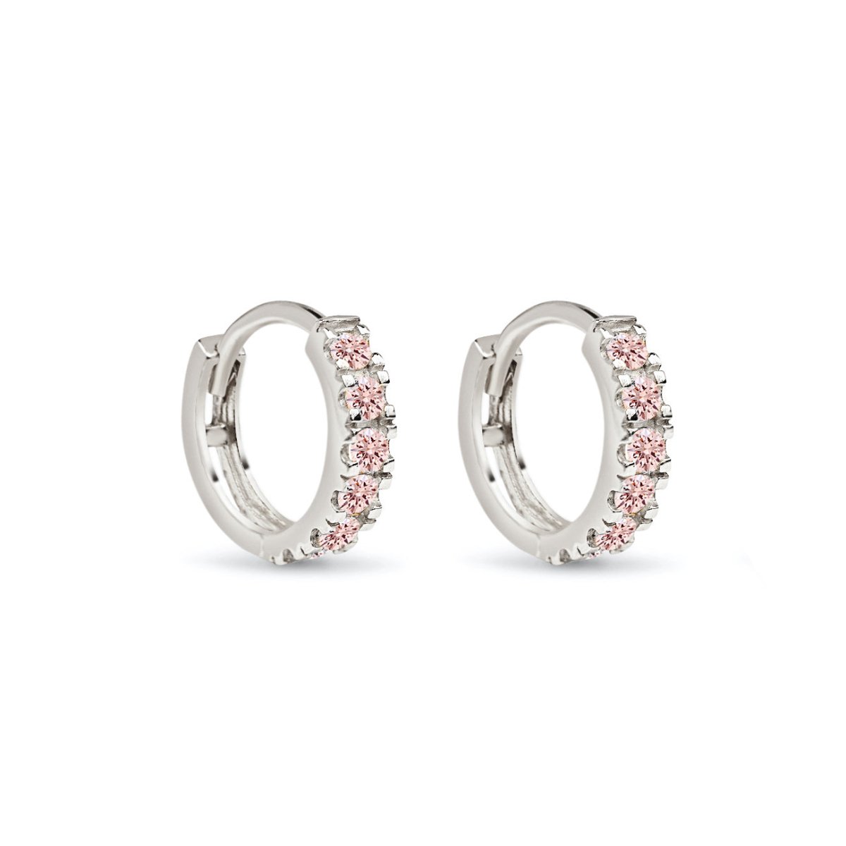 Pair of 14K white gold pave huggie hoops set with pink sapphire stones, on a white background