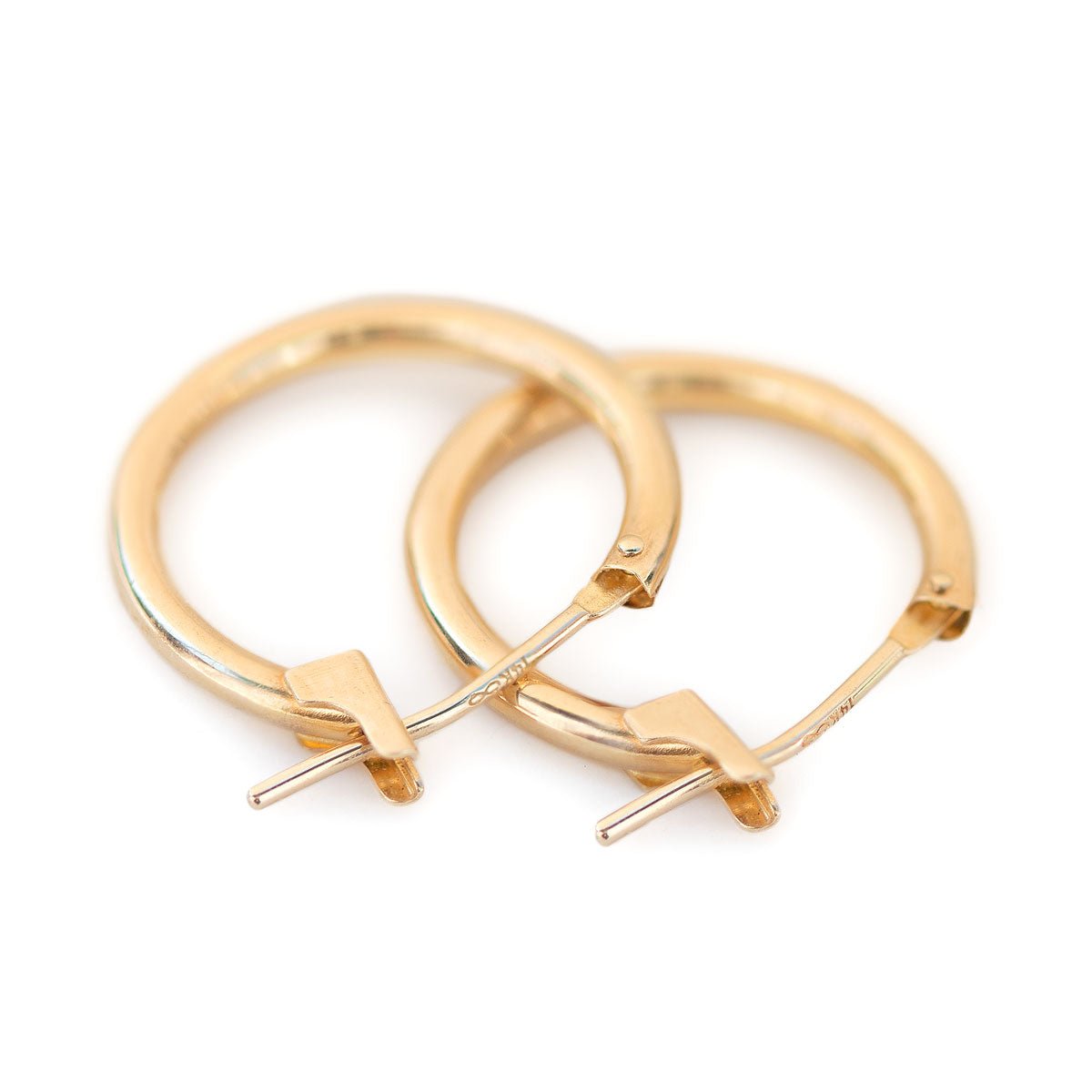 14K gold thin small hoop earrings with hinged latch closures, on a white background