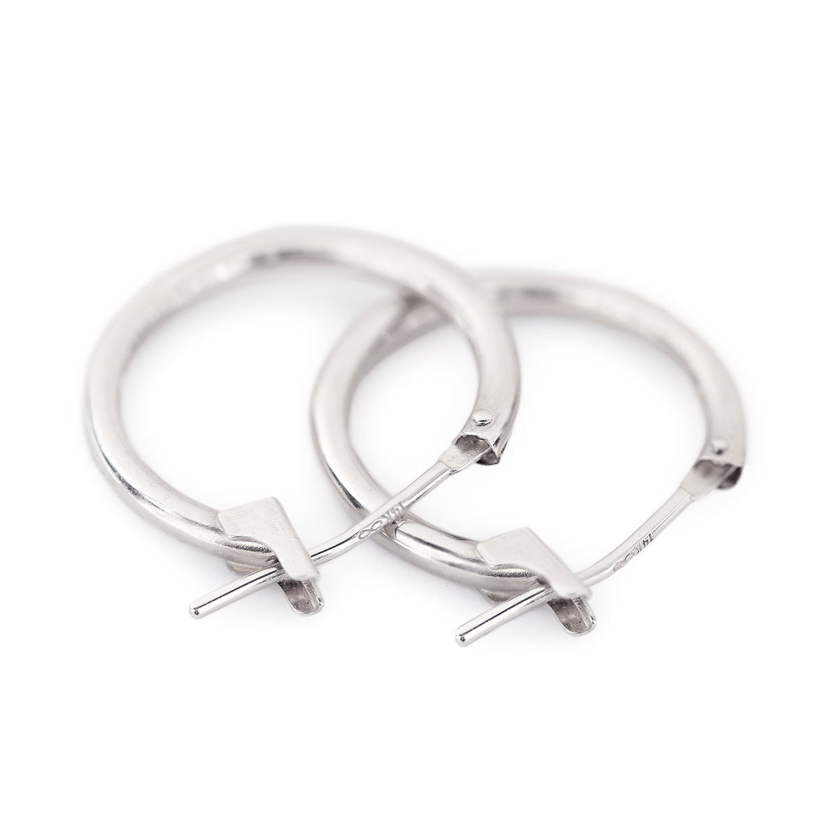 14K white gold thin small hoop earrings with hinged latch closures, on a white background