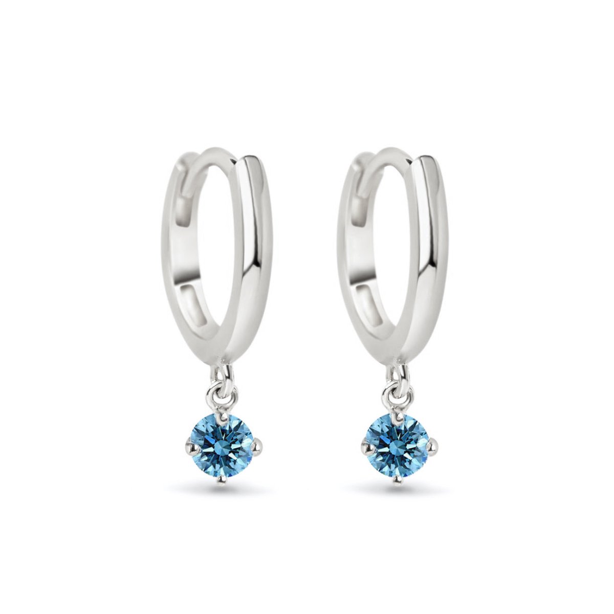 14K white gold huggie hoops with a round blue zircon drop, on a white background