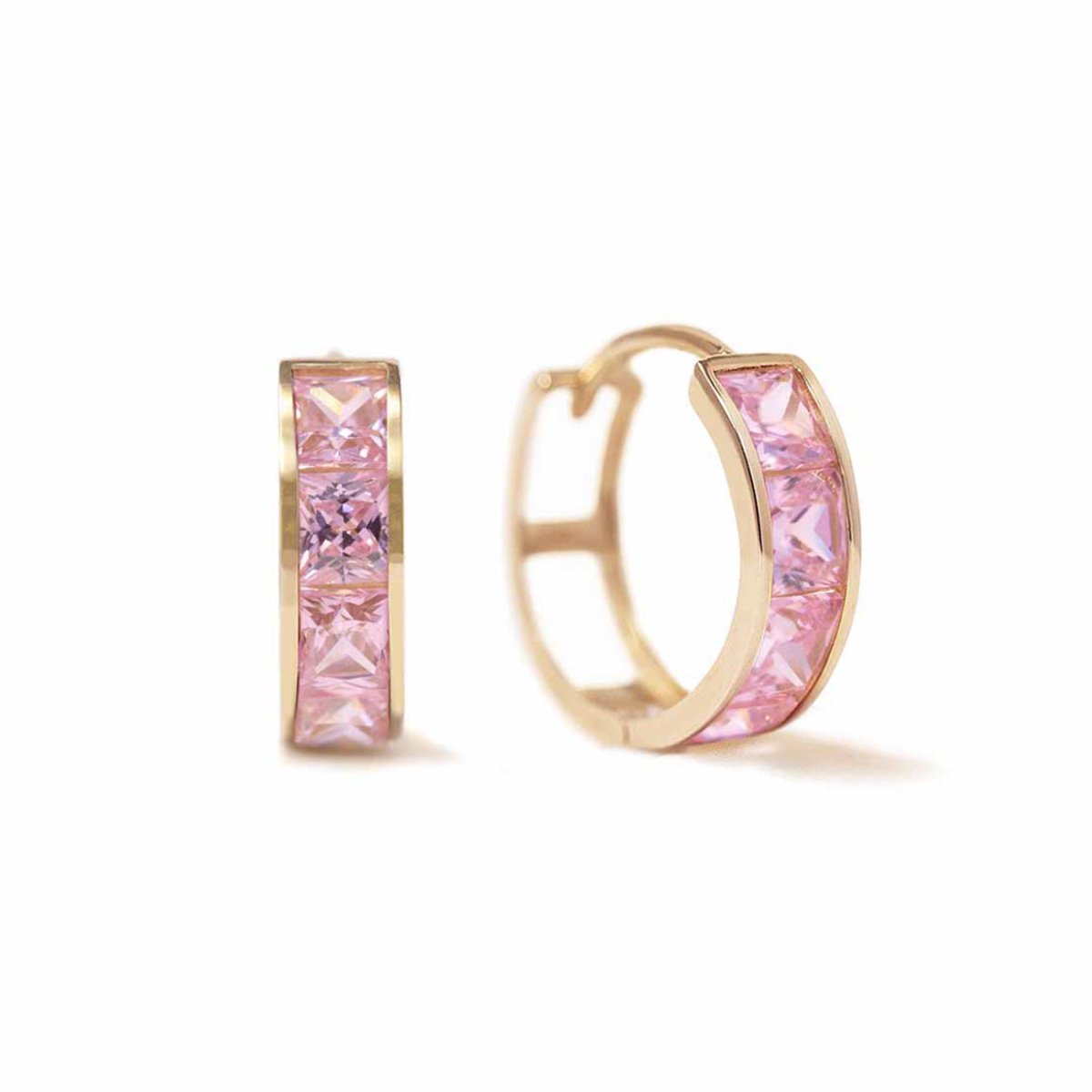 Pair of 14K gold huggie hoops with square pink sapphire stones, on a white background