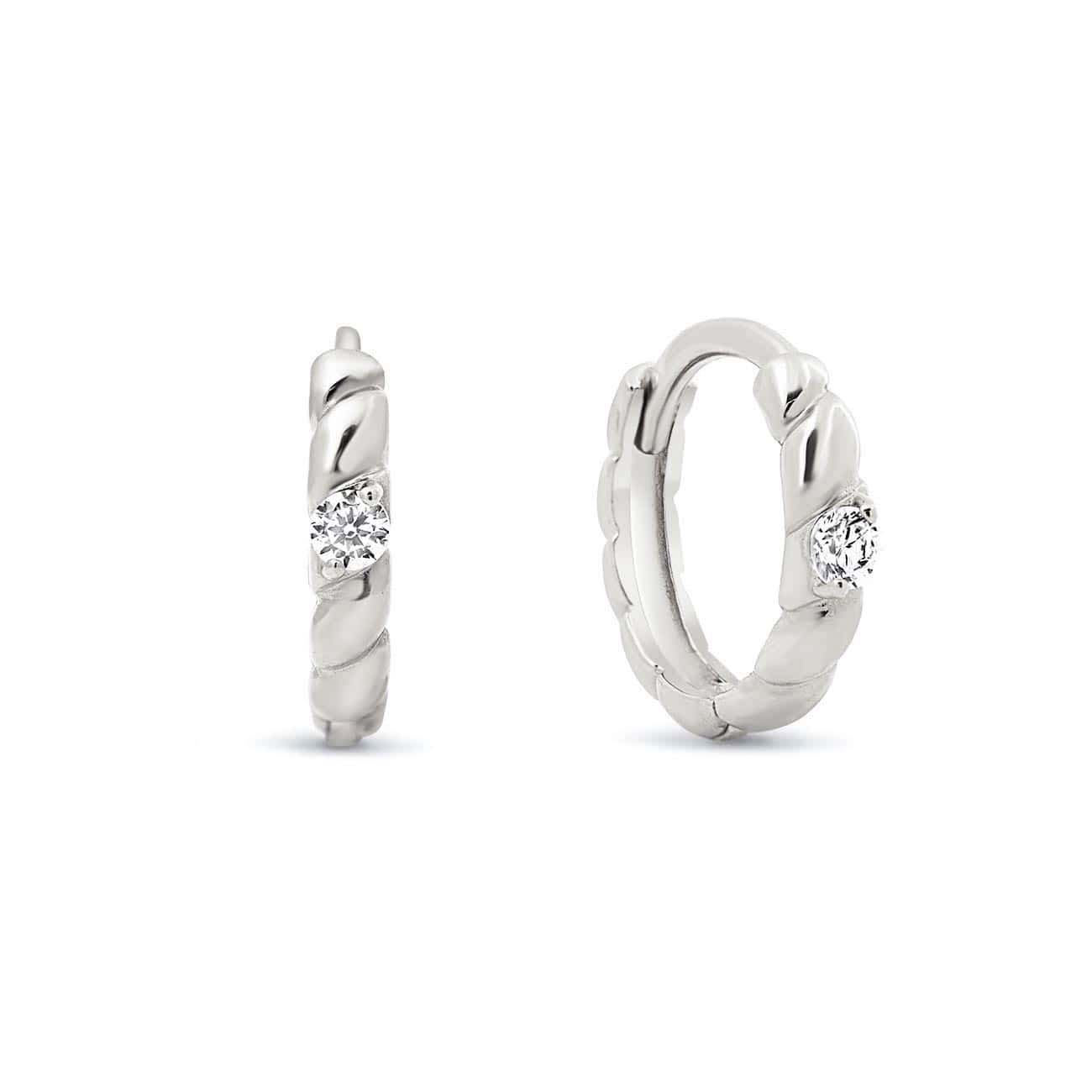 14K white gold rope twist huggie hoops with a single clear stone, on a white background