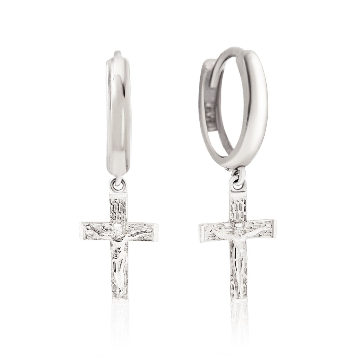 14K white gold huggie hoops with dangling textured crucifix cross charms, on a white background
