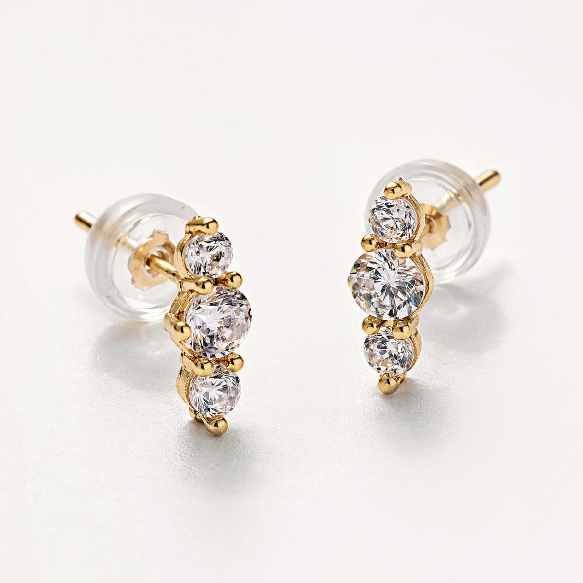 14K gold trio bar studs with three graduated round white zirconia stones, close-up detail