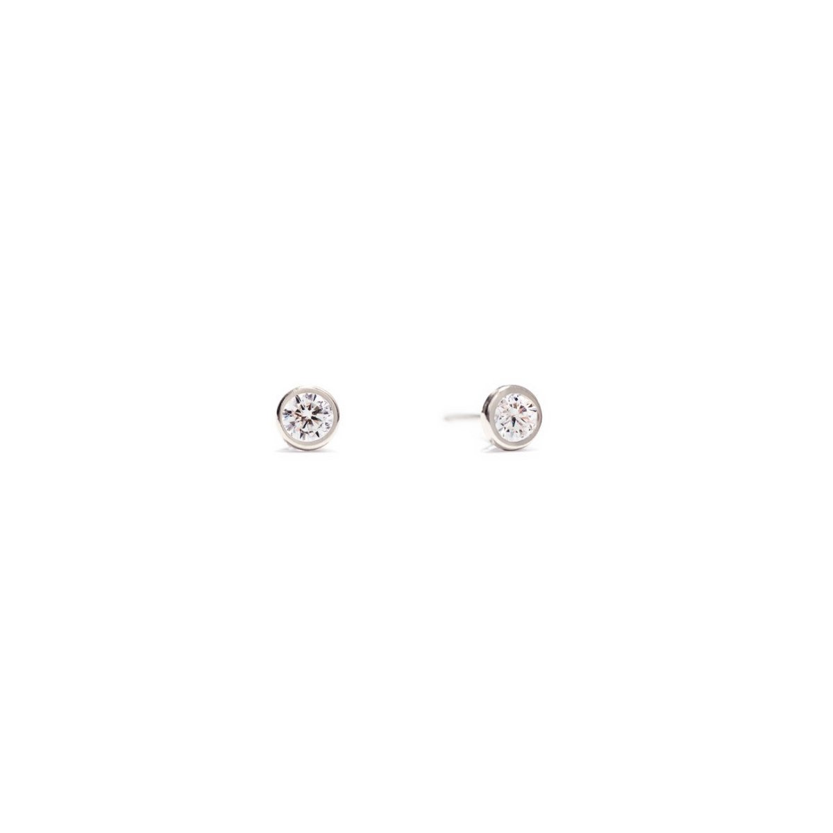14K white gold bezel-set stud earrings with round white zirconia stones, on a white background