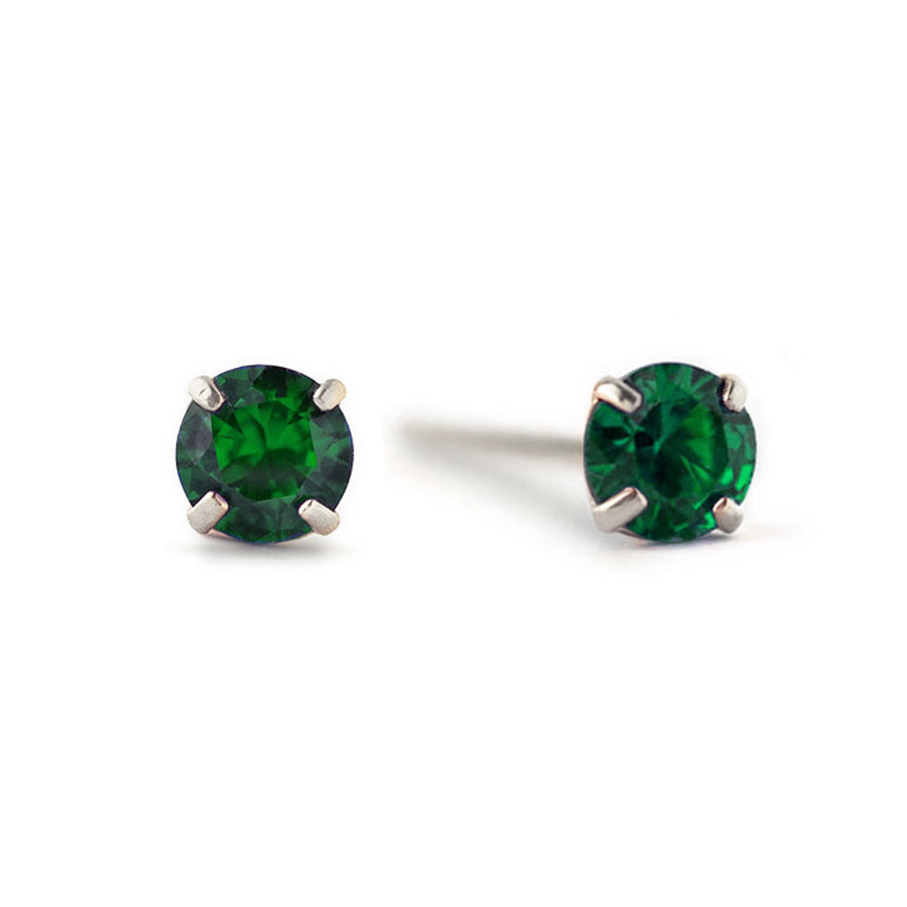 Sterling Silver emerald studs with round green stones in four-prong settings, on a white background