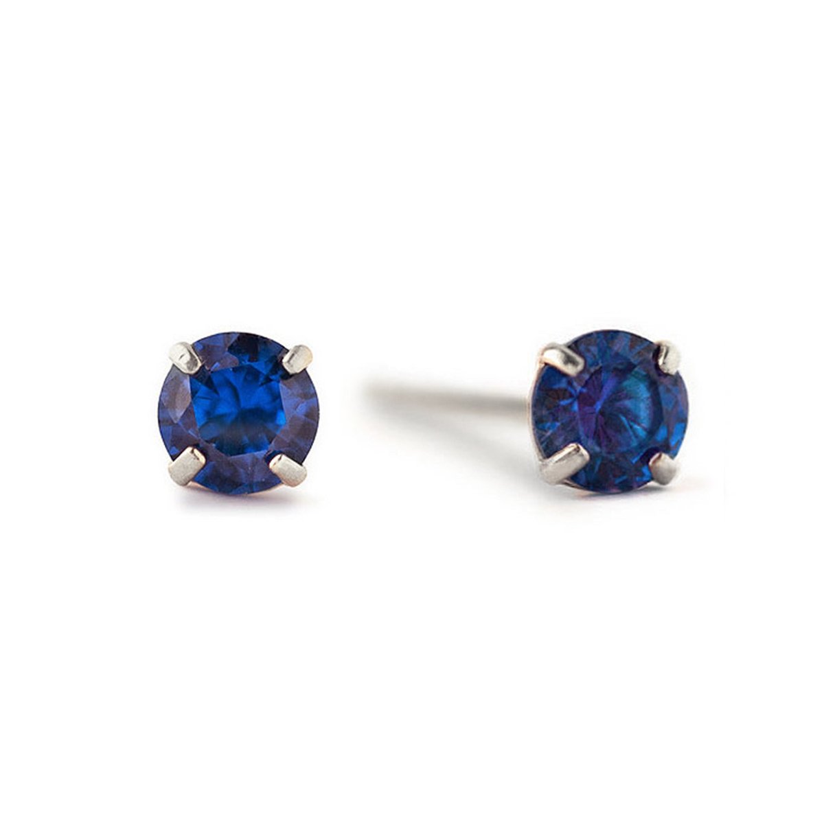 14K white gold blue sapphire stud earrings with round deep-blue stones in prong settings, on a white background