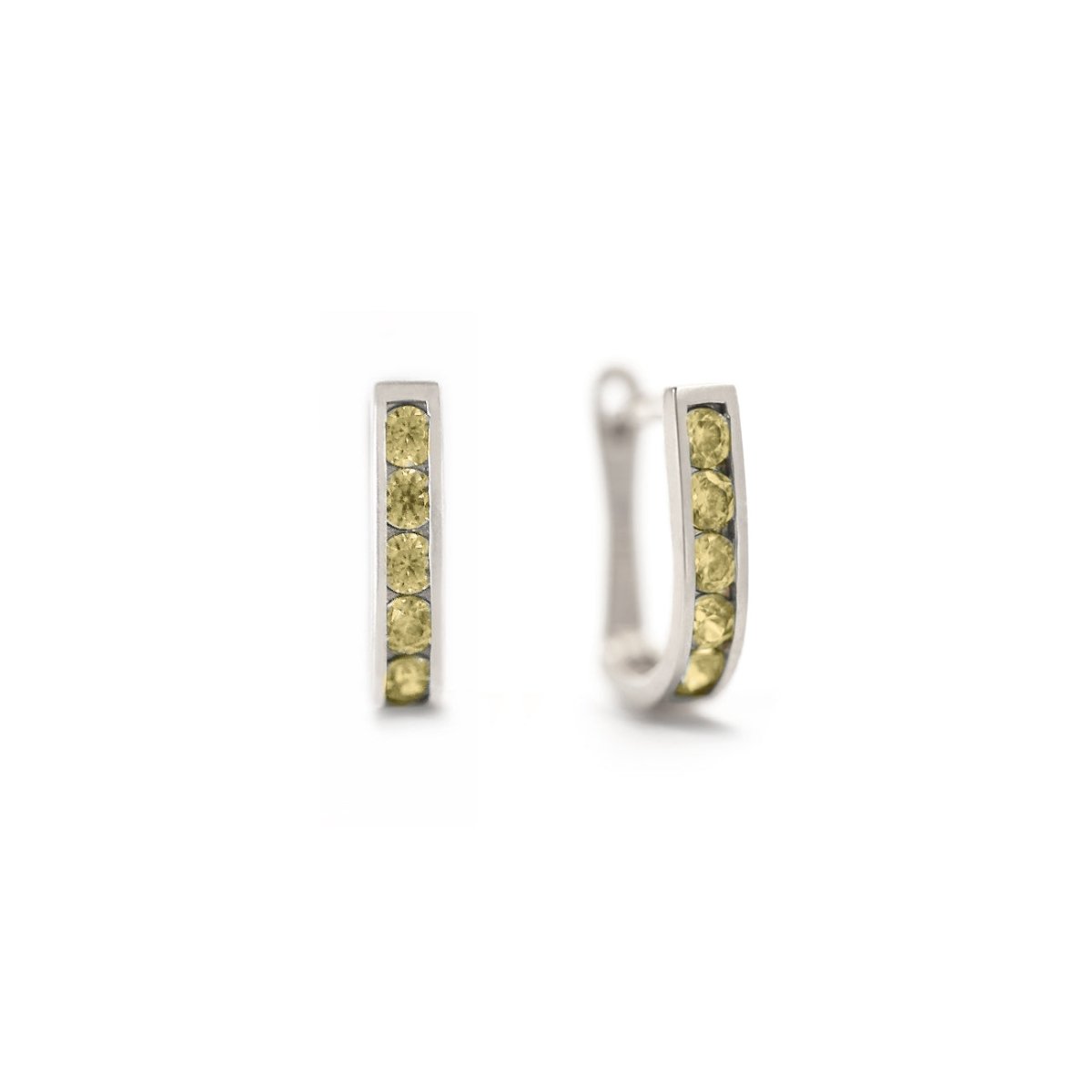 14K white gold U-shaped peridot huggie hoops with channel-set yellow-green stones, on a white background