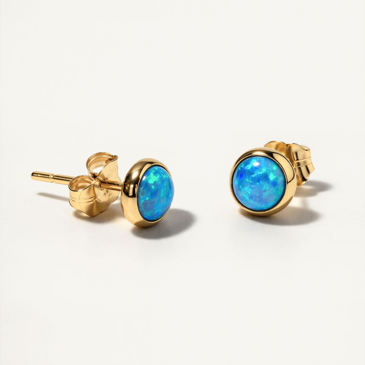 14K Gold Cabochon stud earrings with blue opal stones from AMYO | #Gemstone_Light Blue Opal