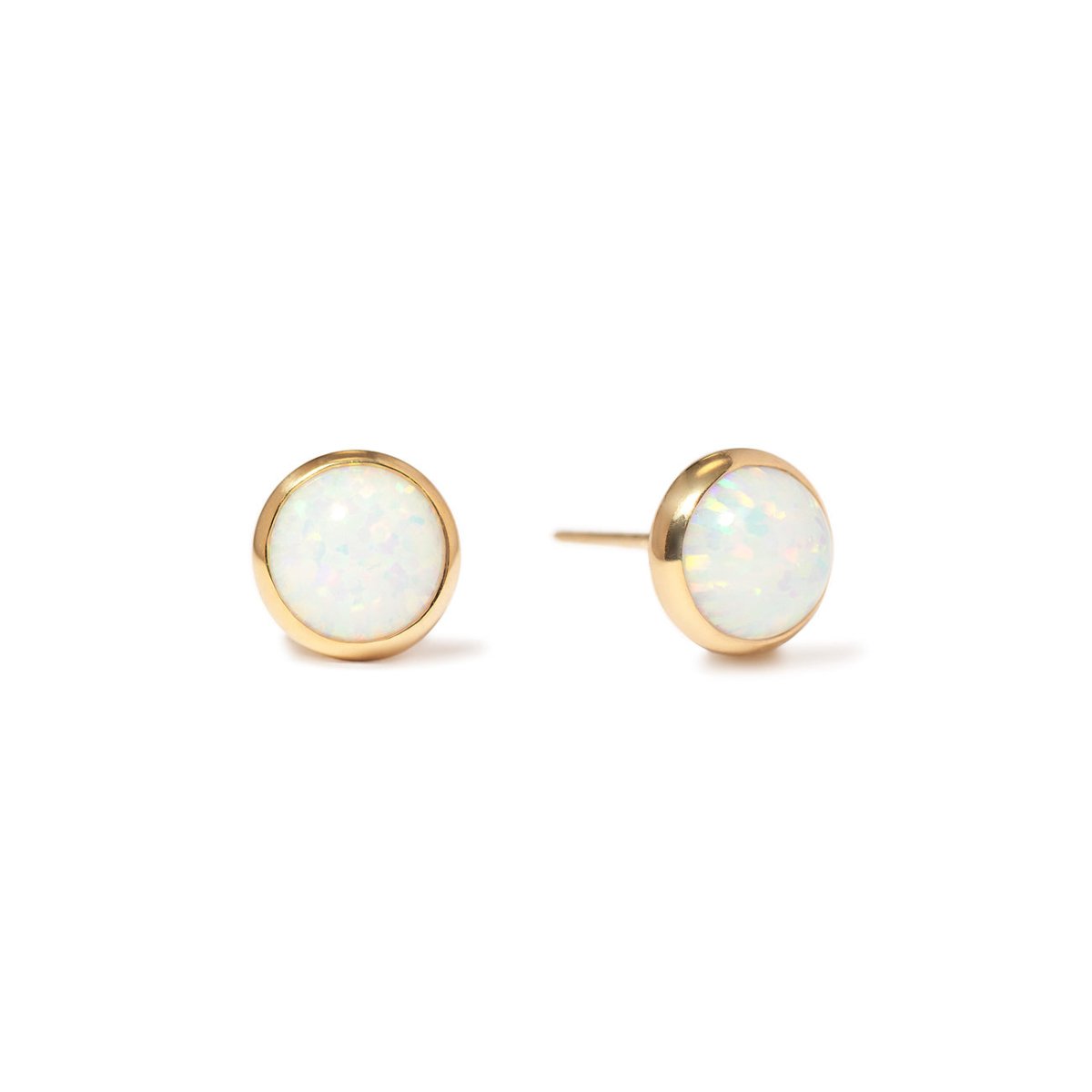 A pair of opal cabochon stud earrings set in 14K gold, with a white opal center surrounded by a gold rim | #Gemstone_White Opal