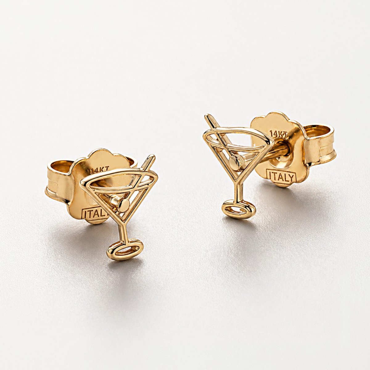 14K gold martini glass stud earrings, close-up detail on a white background