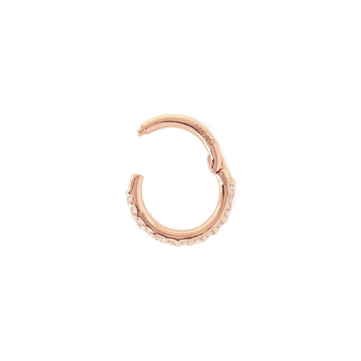 Close-up of 14k rose gold cartilage pave hoop earring