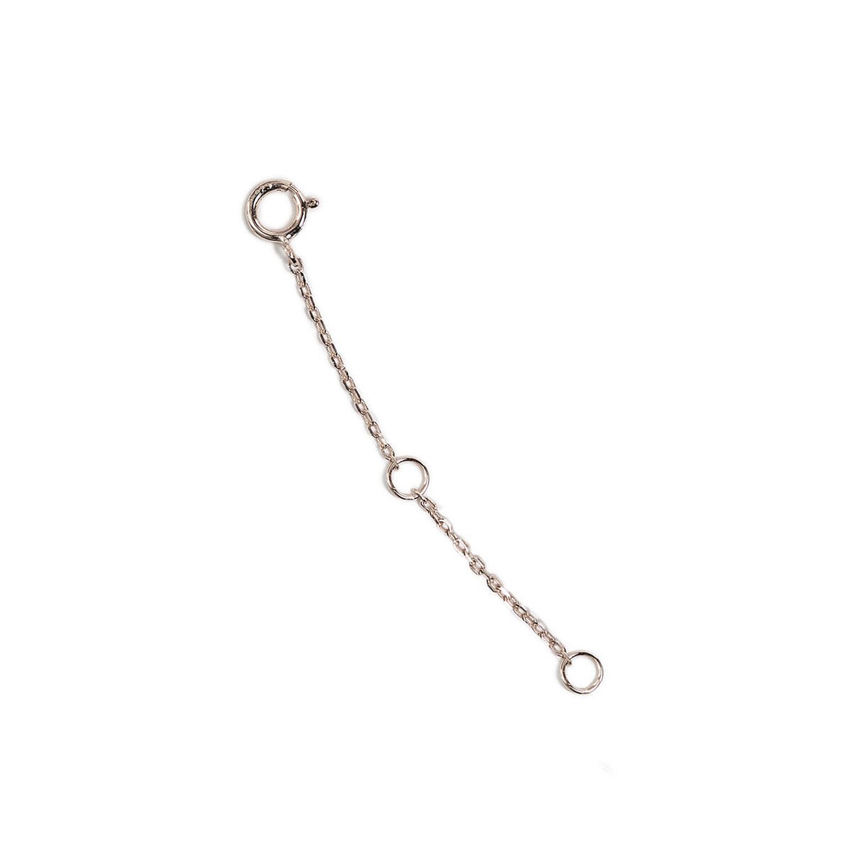 Sterling silver necklace extender chain with a spring-ring clasp and jump rings, on a white background