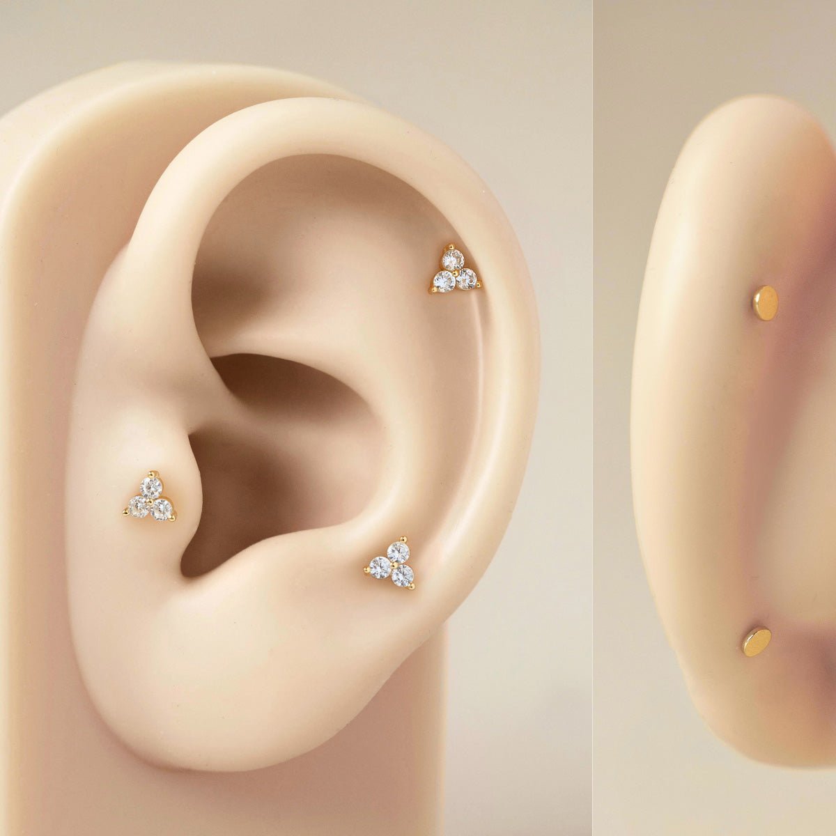 Sterling silver trio white zirconia flat back studs shown on a silicone ear placement model