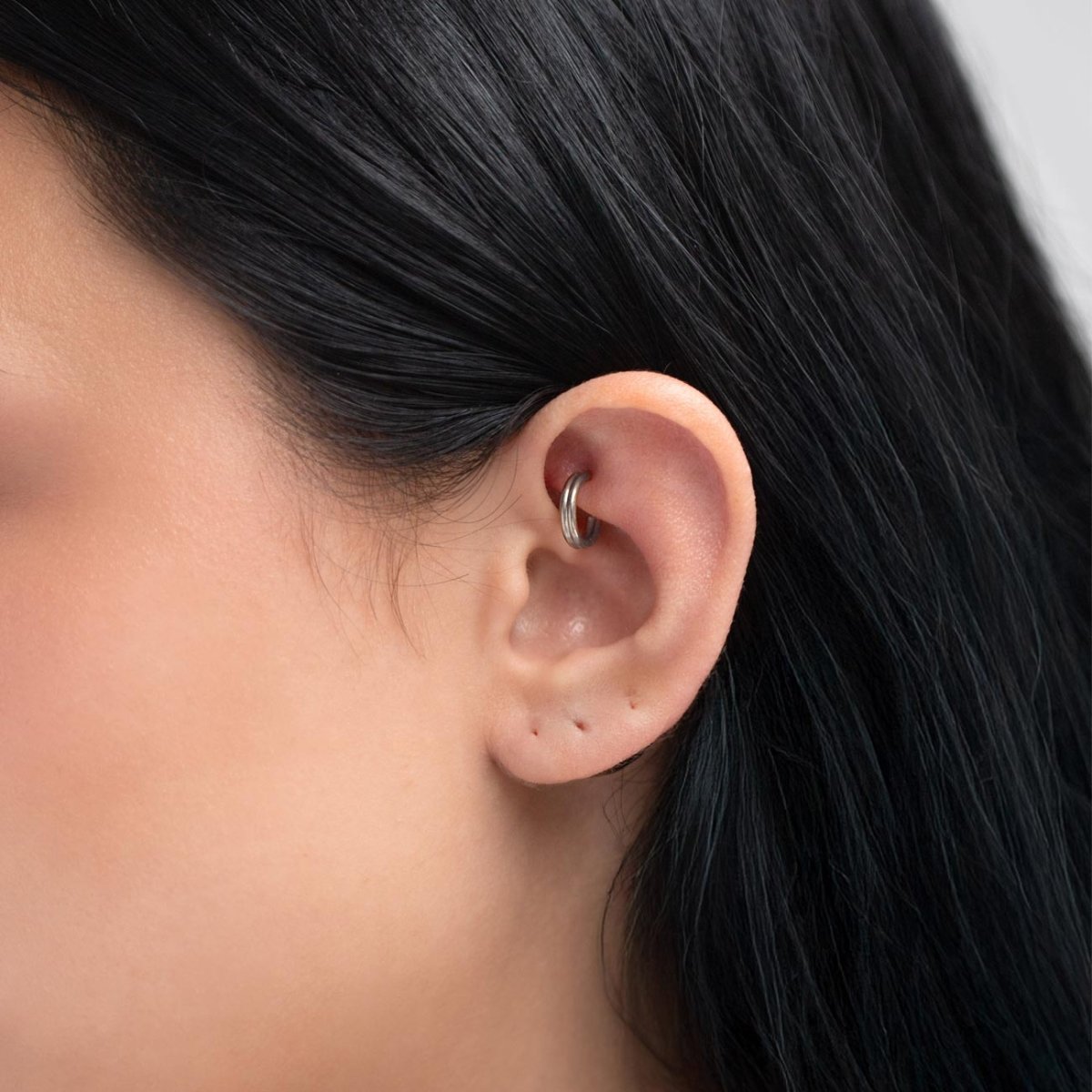 caption: Model wearing 6mm on rook