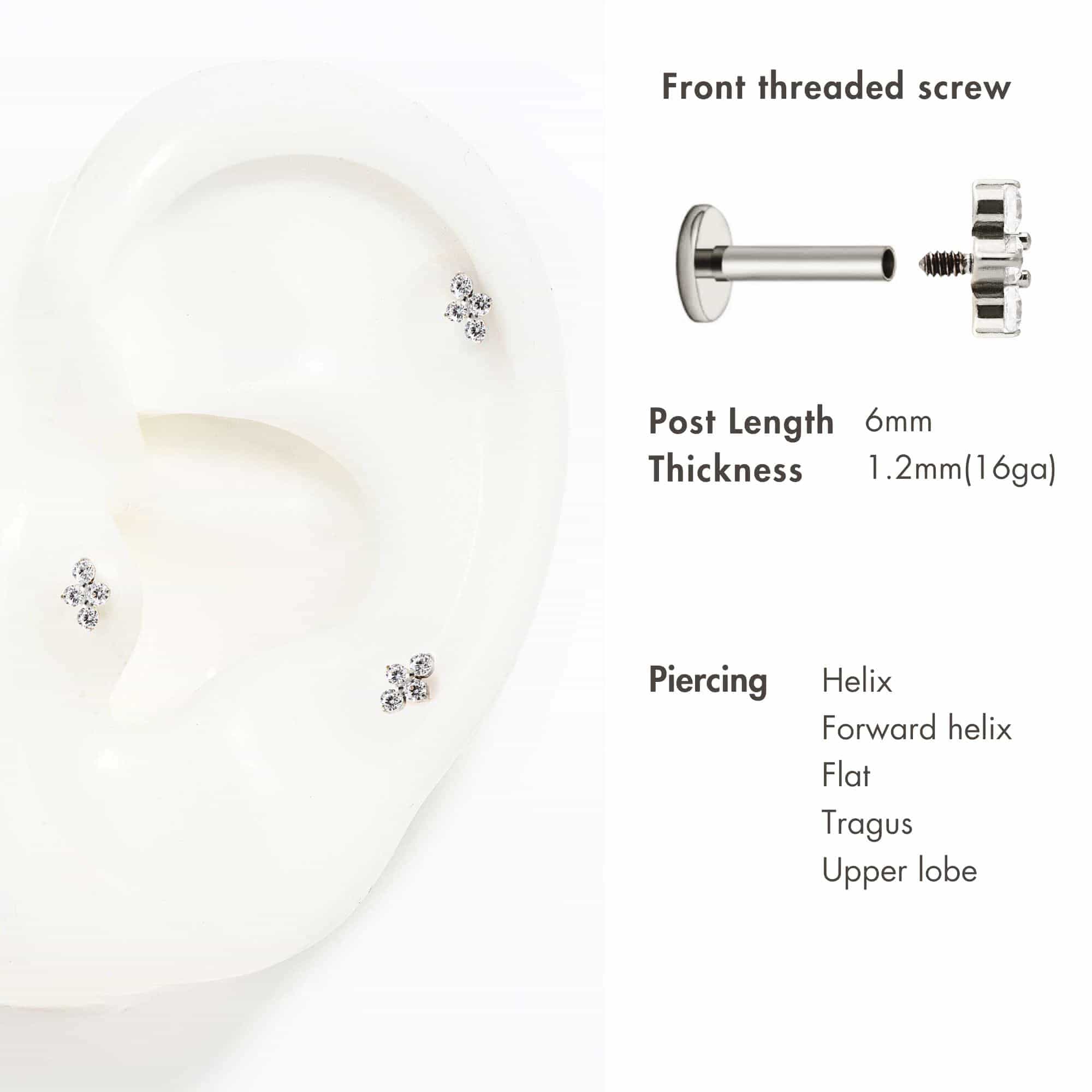 Titanium trinity flat back studs with three clear stones, shown on a white ear display with piercing guide