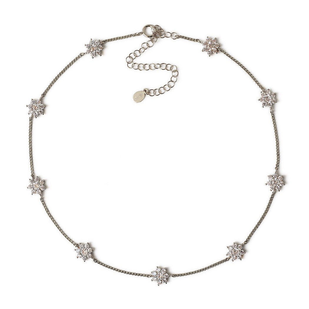 Sterling silver choker with clear crystal flower stations and an adjustable chain, on a white background