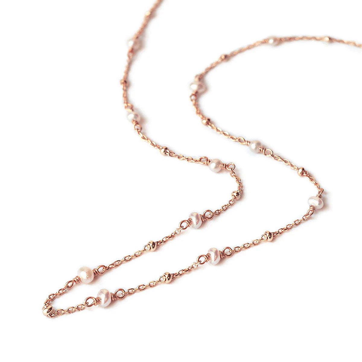 Rose gold vermeil pearl choker necklace, close-up detail of pearls along the chain, on a white background