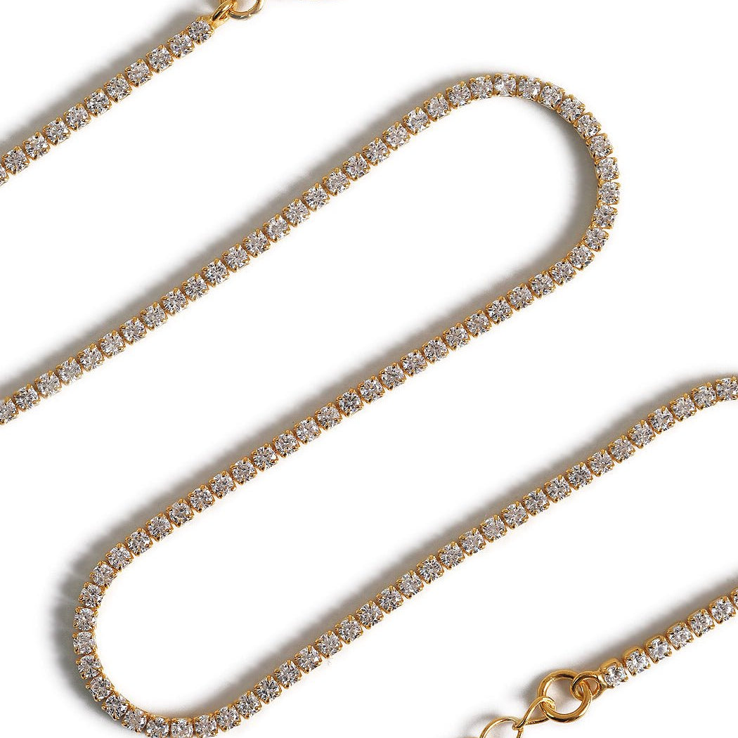 Gold vermeil crystal choker, close-up detail of the round clear stones in a row, on a white background