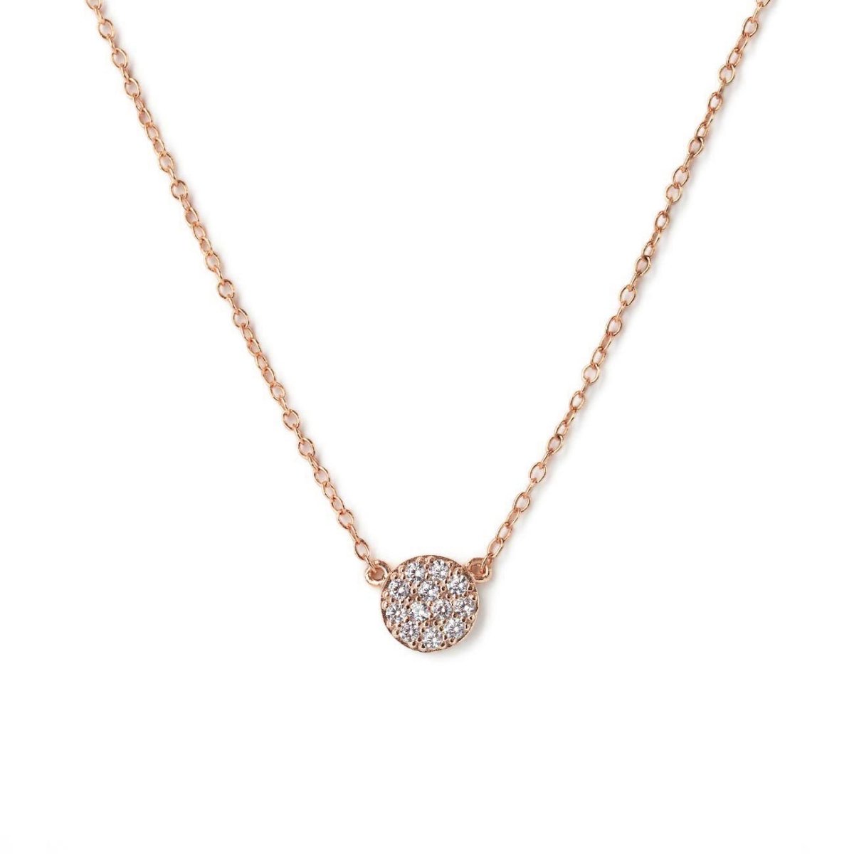 Rose gold vermeil pavé disc necklace with white zirconia on a thin chain, on a white background