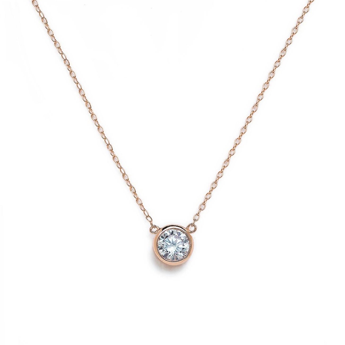Rose gold vermeil solitaire necklace with a round bezel-set white zirconia, on a white background