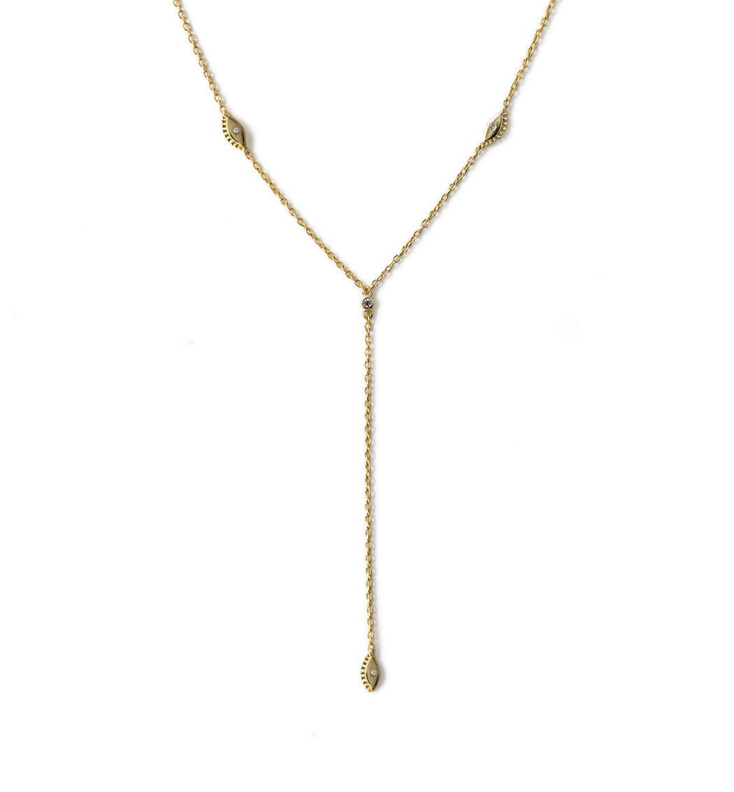 Gold vermeil evil eye lariat necklace with marquise charms and clear stones, on a white background