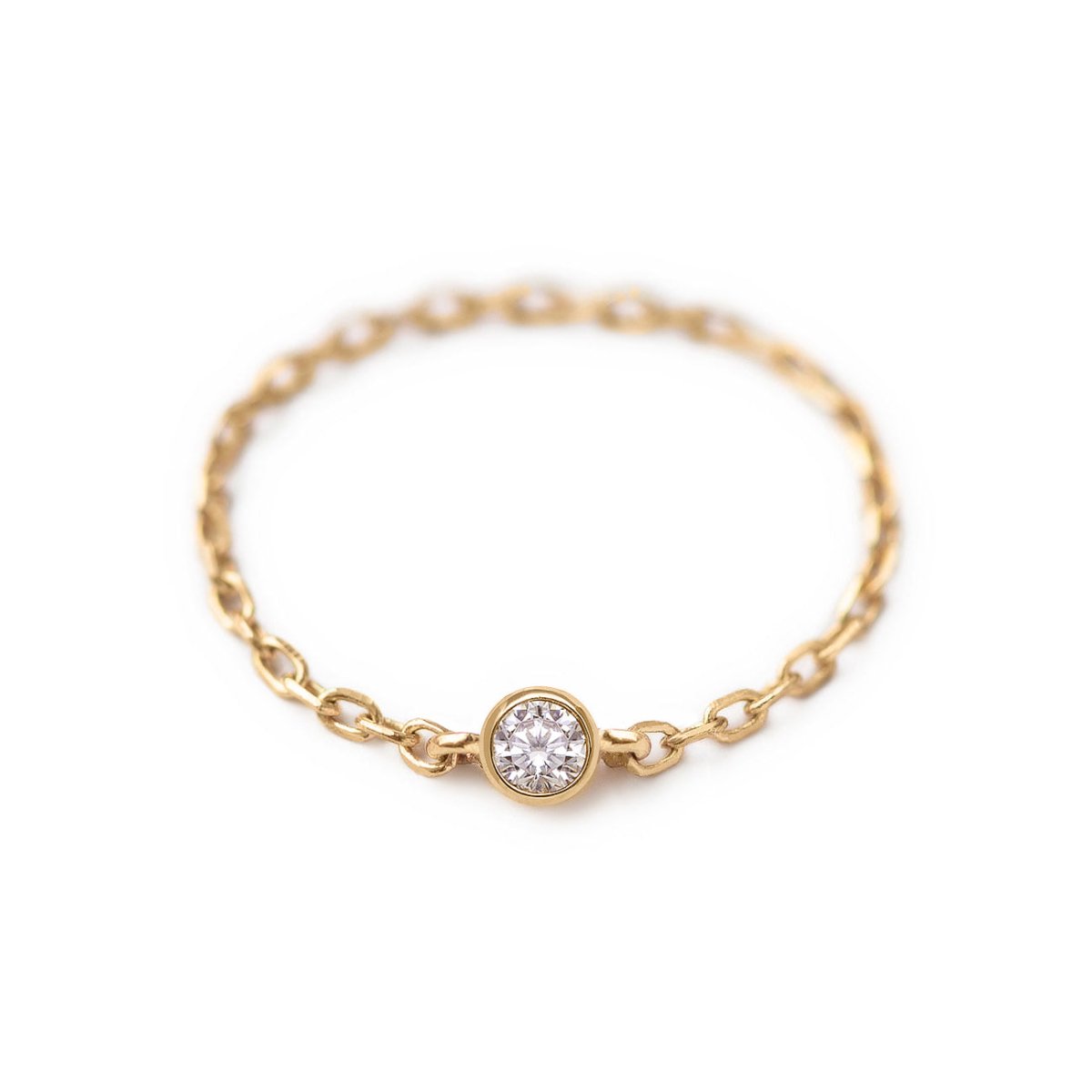 14K gold vermeil chain ring with a single bezel-set clear stone, on a white background