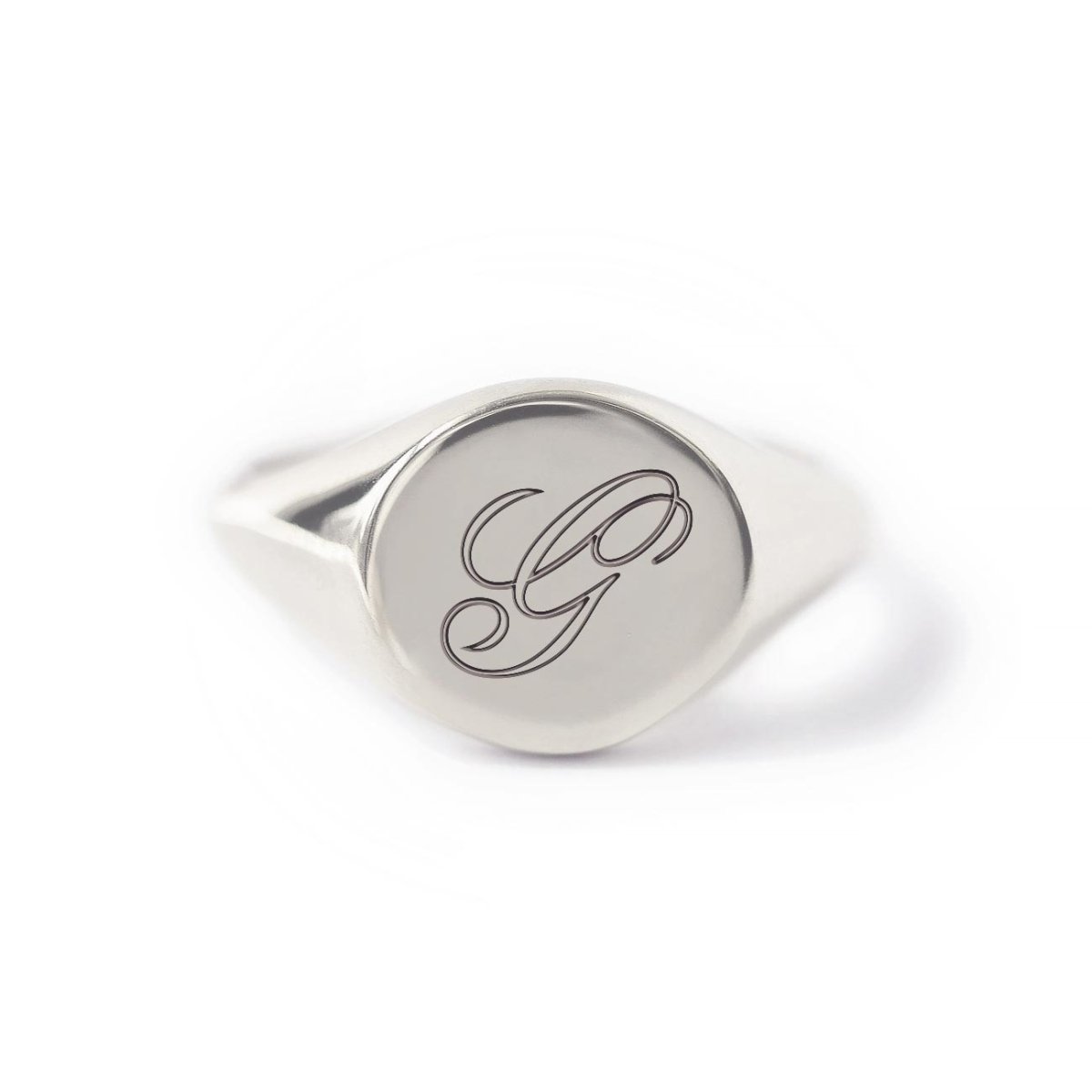 Sterling silver signet ring engraved with a script initial, on a white background