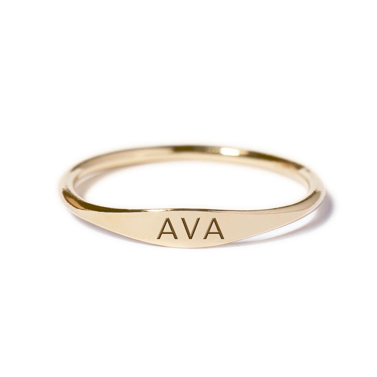 Gold-filled thin signet ring engraved with a name, shown on a white background