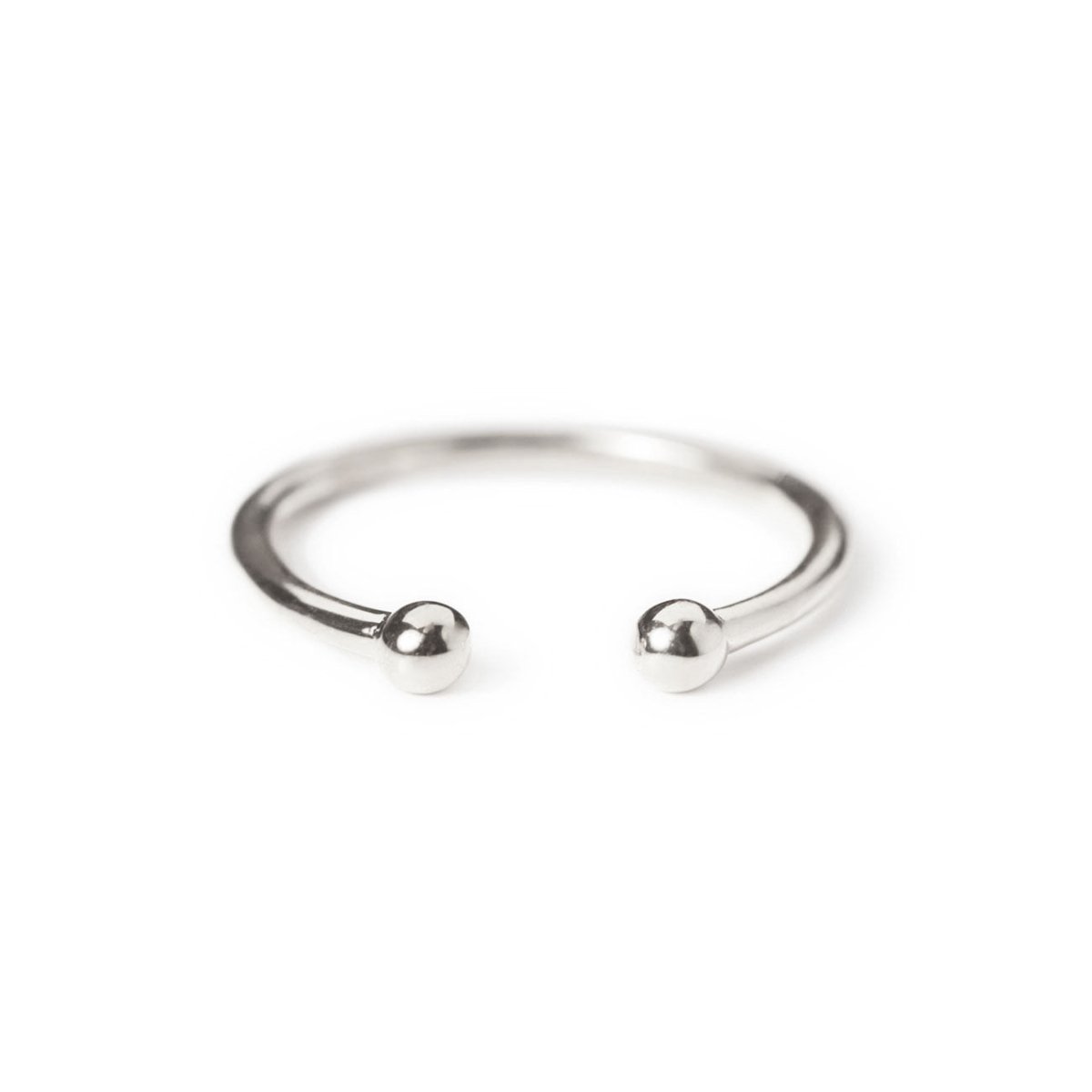 Sterling silver open ring with two ball ends, on a white background
