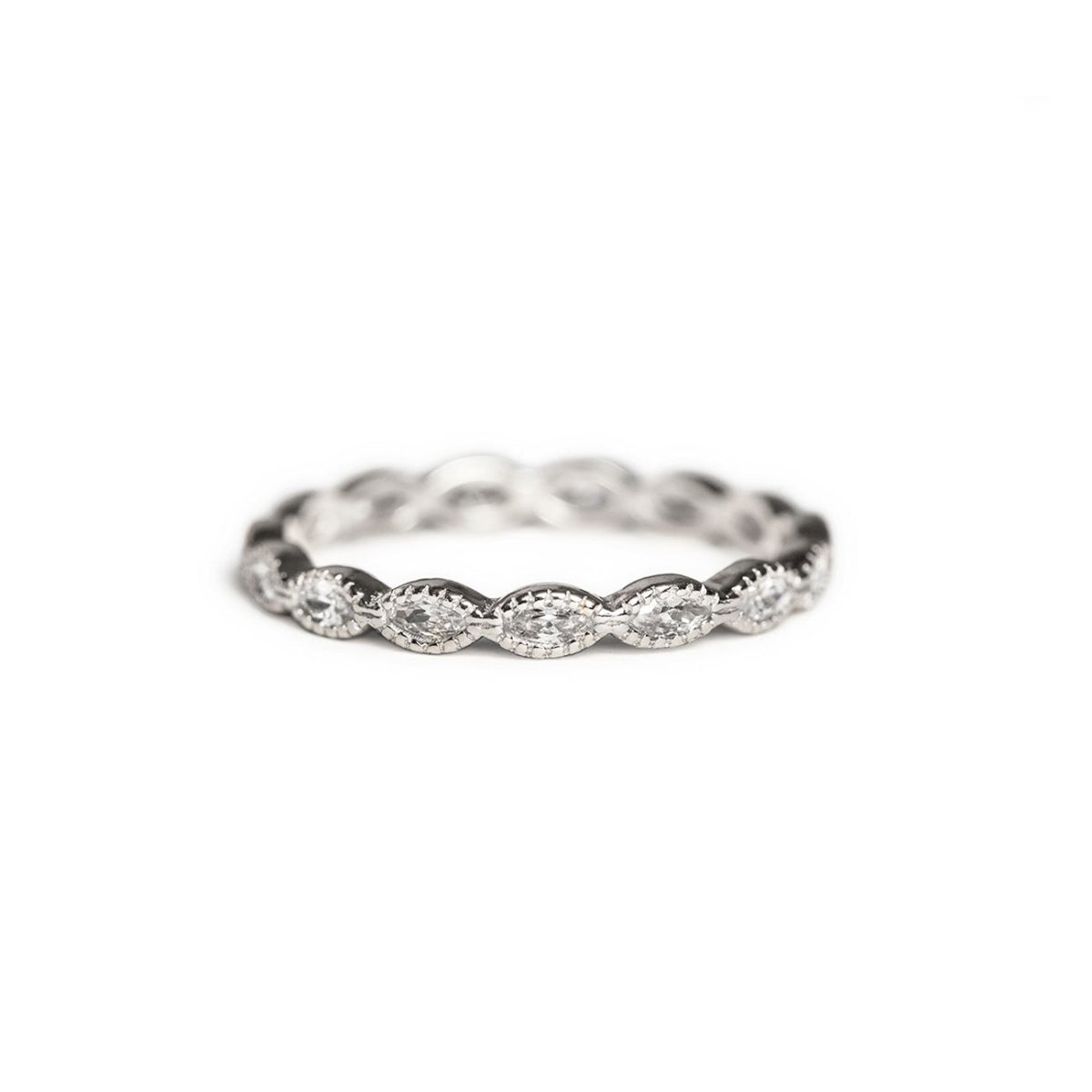 Sterling silver marquise white zirconia eternity band ring with milgrain detail, on a white background